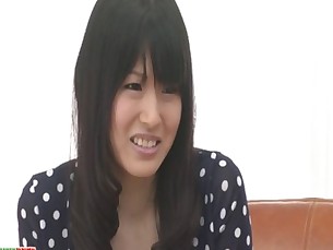 Nozomi Koizumi strips naked and gives an asian blowjob