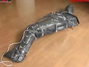 Ballgagged asian girl tied into a leather sleepsack teased and vibed