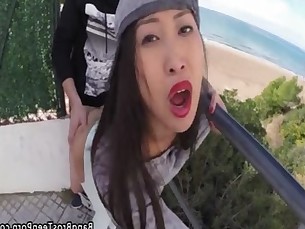 Busty asian takes a dick up the ass in public